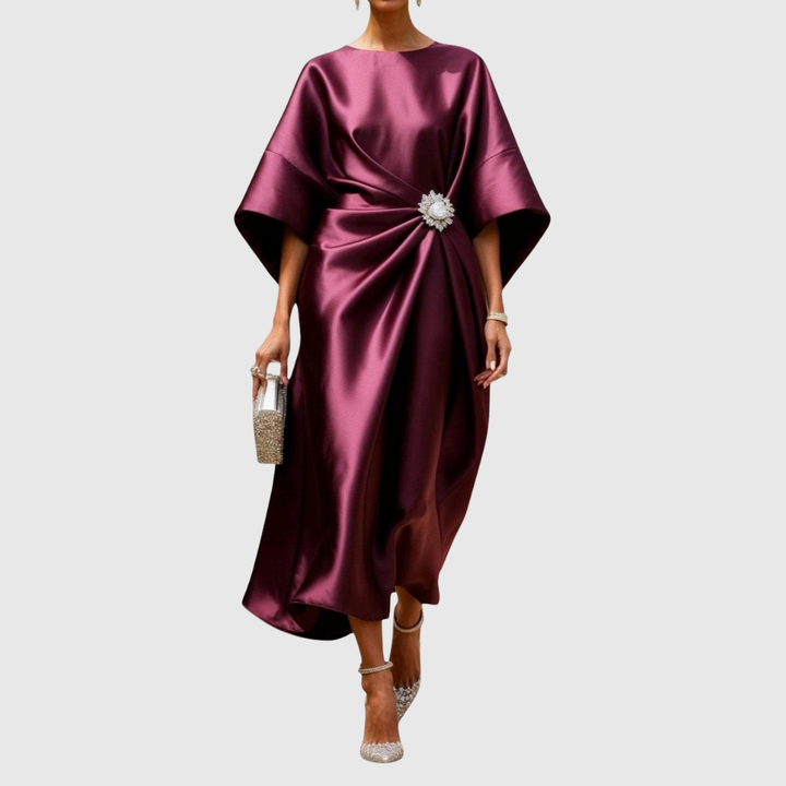 Women's elegant long-sleeve midi dress featuring a sculpted waist and exquisite brooch detail. Perfect for evening.