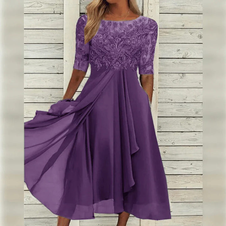 Elegant women's midi dress with intricate lace detail & flowing skirt. Perfect for special occasions & formal events.