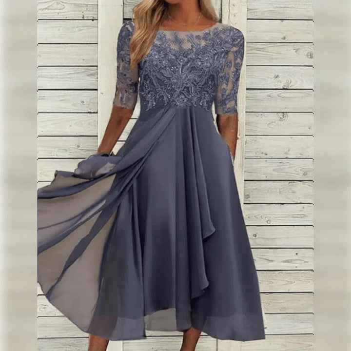 Luxurious women's lace detail midi dress with an elegant flowing skirt, perfect for sophisticated special occasions.