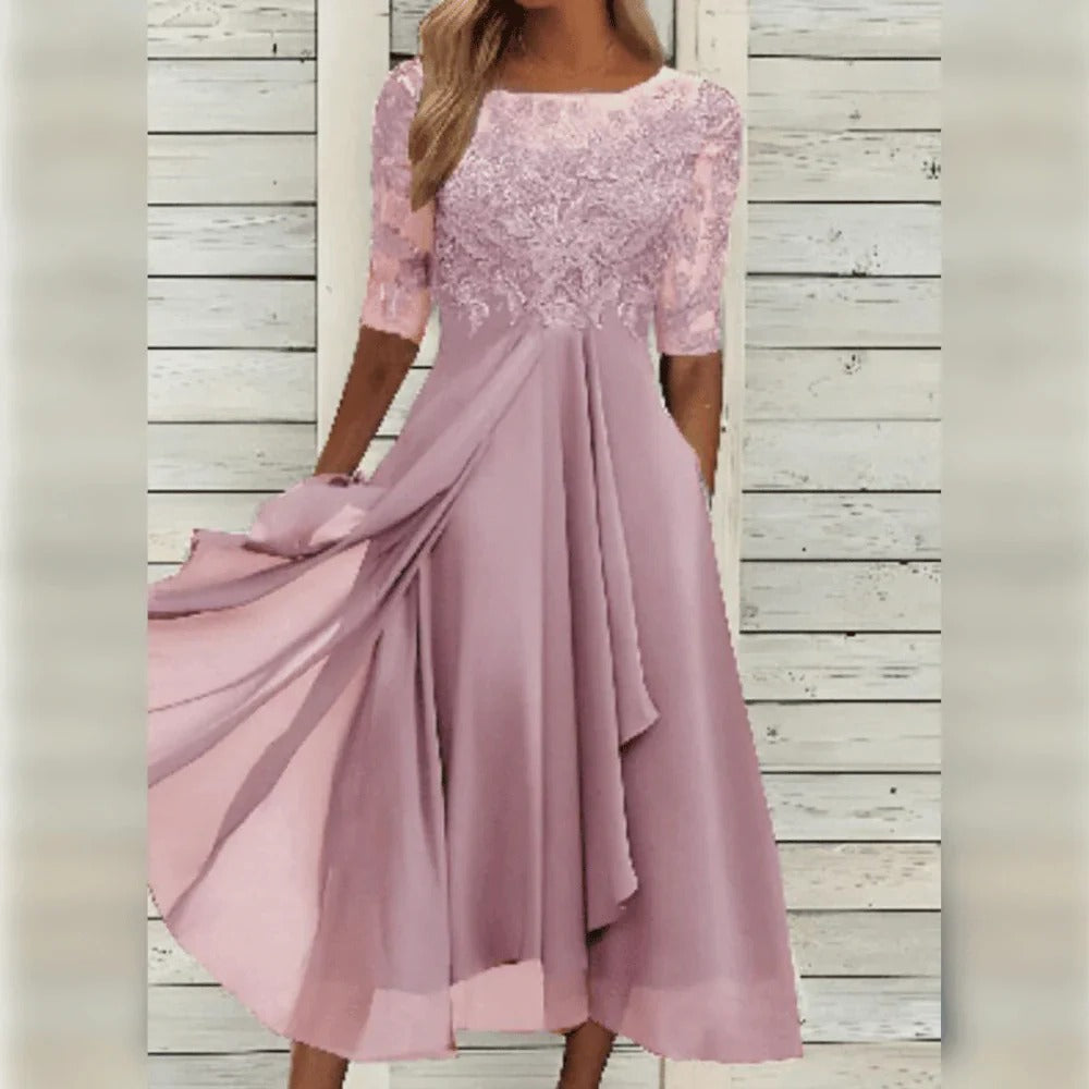 Versatile women's cocktail midi dress with lace, round neck & three-quarter sleeves. Suitable for evening events.