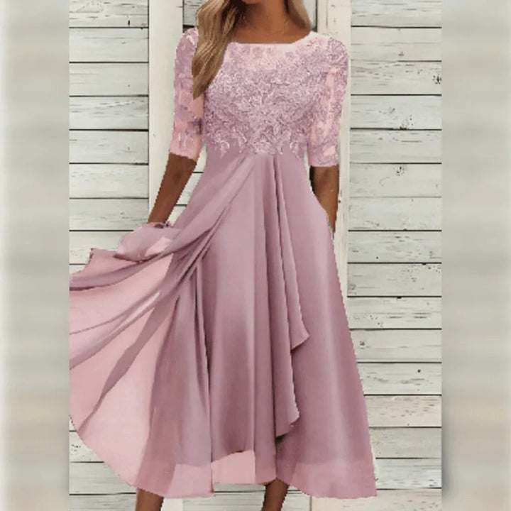 Versatile women's cocktail midi dress with lace, round neck & three-quarter sleeves. Suitable for evening events.