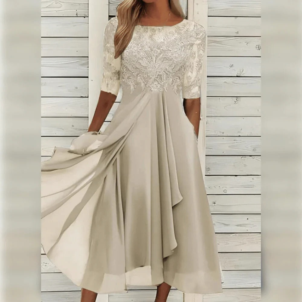 Graceful women's evening midi dress with intricate lace detailing & a beautiful flowing skirt for formal occasions.