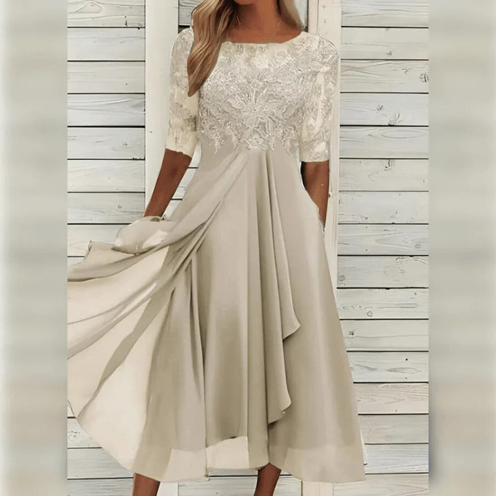 Graceful women's evening midi dress with intricate lace detailing & a beautiful flowing skirt for formal occasions.