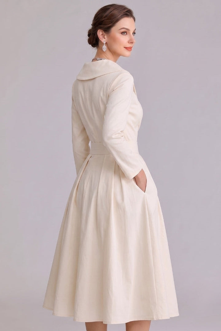 Stylish modest midi dress for women, featuring practical pockets and a timeless design, suitable for spring/autumn.
