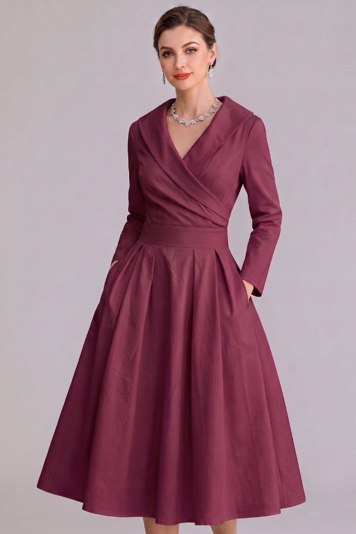 Chic autumn/spring women's midi dress, combining elegant style with practical pockets for everyday wear.