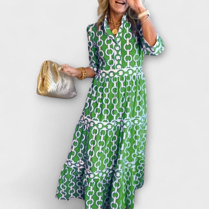 Stylish tiered skirt of a women's midi dress, featuring an elegant chain pattern. Ideal for summer occasions.