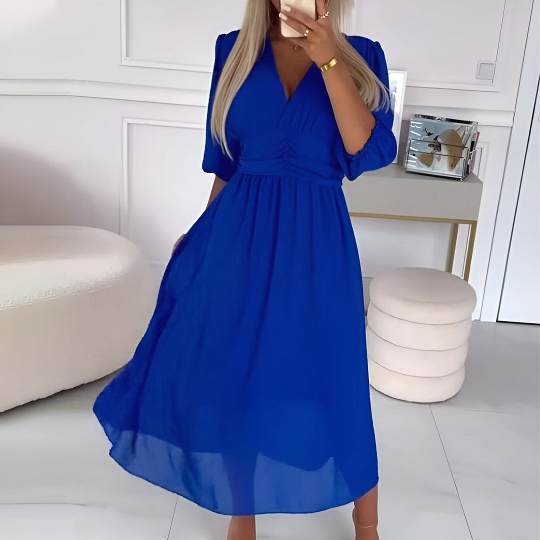 Chic women's wrap midi dress in a comfortable fabric, showing the flattering adjustable fit. Elegant and versatile for any occasion.