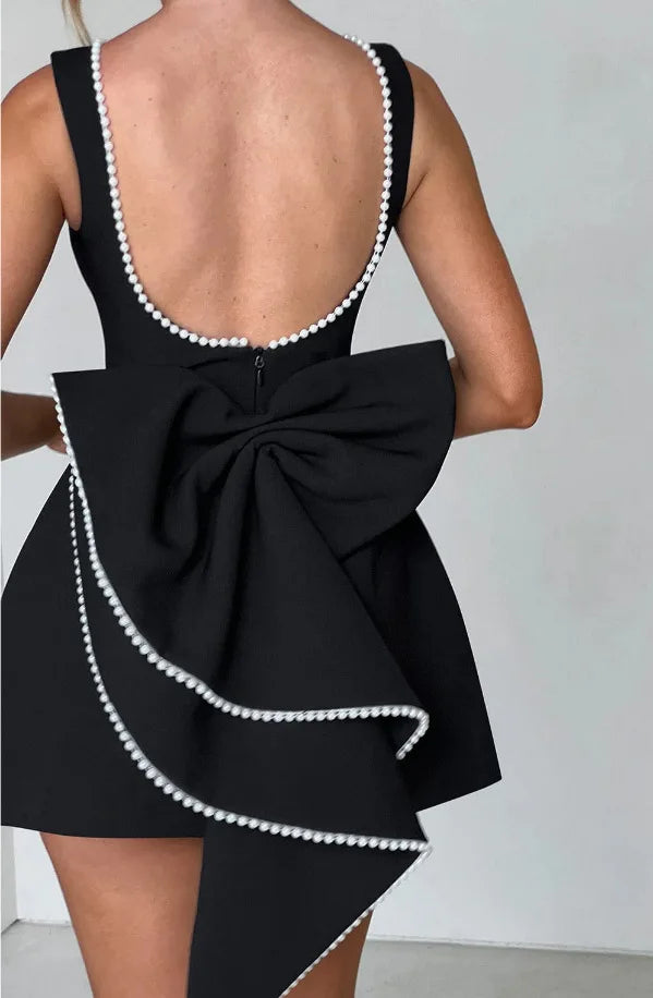 Modern women's mini dress, an elegant and flattering choice for parties, cocktails, and versatile fashion.