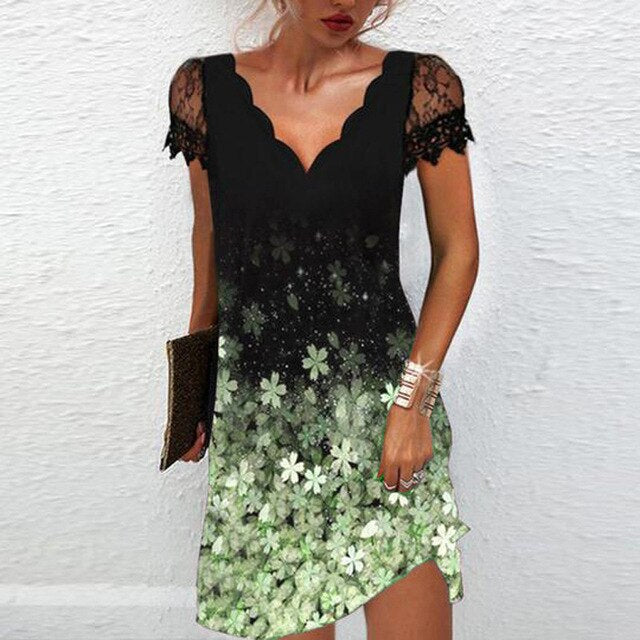 Party-ready women's mini dress, elegant design, featuring sheer lace sleeves & a distinct scalloped V-neck.