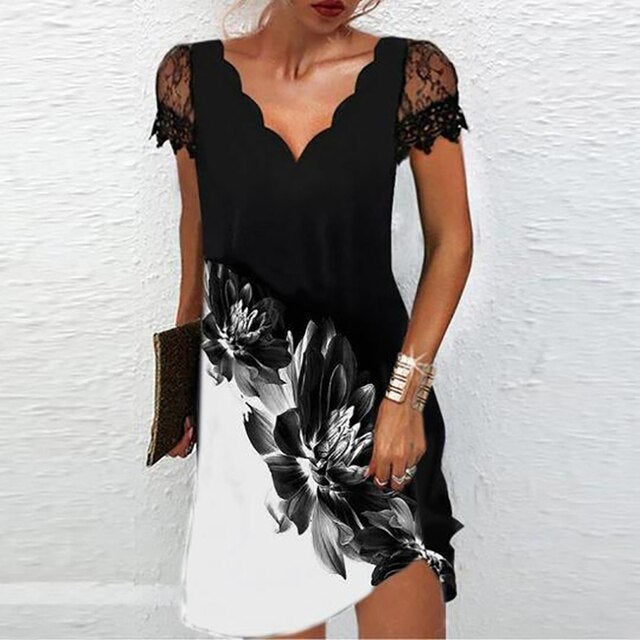 Women's elegant mini dress with stylish lace sleeves, a chic scalloped V-neck & flowy silhouette.