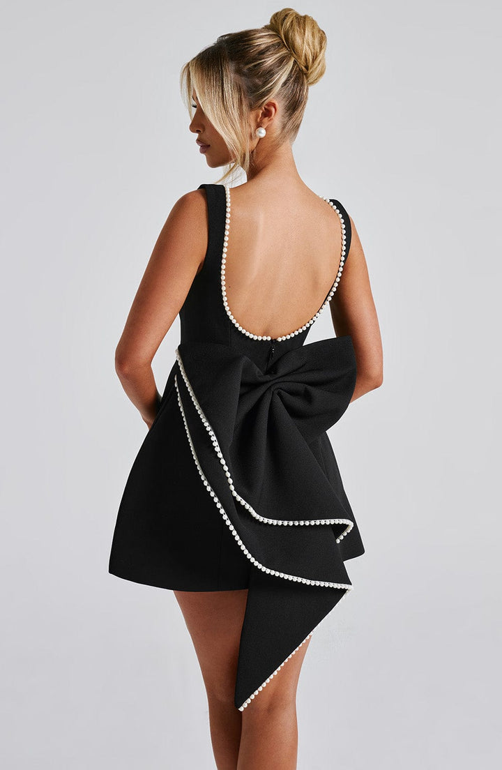 Pearl trim mini dress for women, elegant and sleeveless, with a beautiful statement bow back.