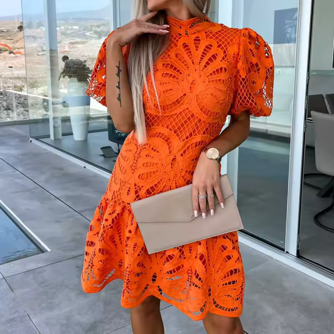 Sophisticated women's short dress, ideal for parties, boasting elegant ruffles and a striking cut-out detail.