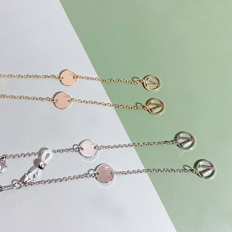 Gold tone modern pendant necklace for women, elegant fashion jewelry with a contemporary design.