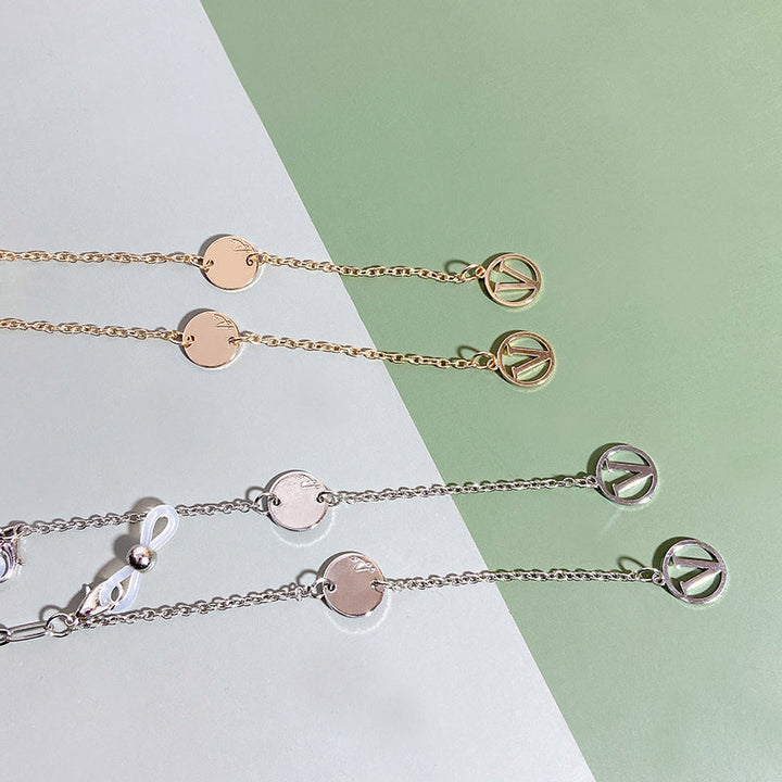 Gold tone modern pendant necklace for women, elegant fashion jewelry with a contemporary design.