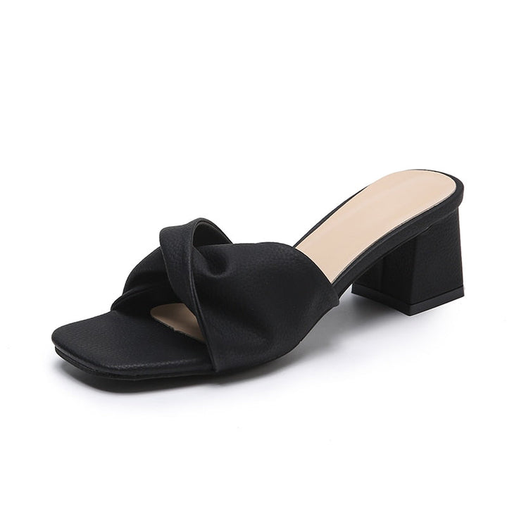 Summer women's block heel mule sandals. Elegant twisted strap slip-on heels for dressy occasions and comfort.