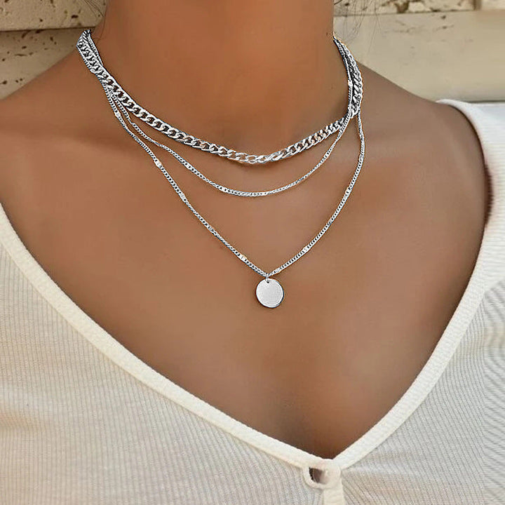 Stylish women's multi-layered chain necklace, showcasing delicate chains in chic gold. Perfect fashion accessory.