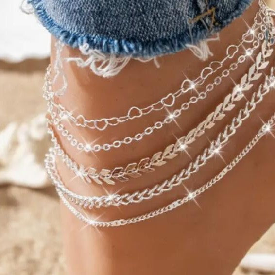 Elegant women's multi-layered gold chain bracelet set, perfect fashion accessory for sophisticated style.