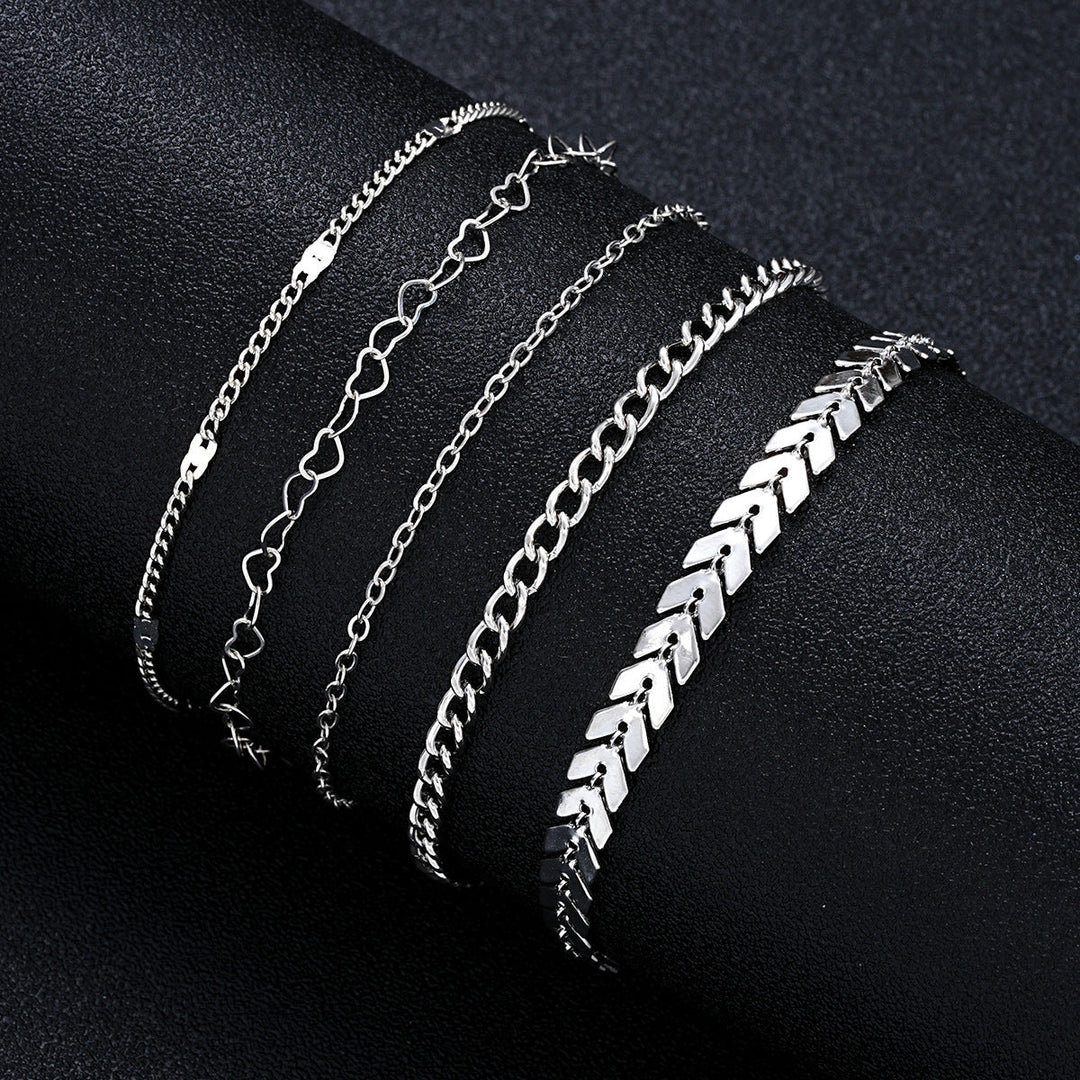 Close-up of a shimmering gold layered chain bracelet, featuring delicate adjustable links for women.