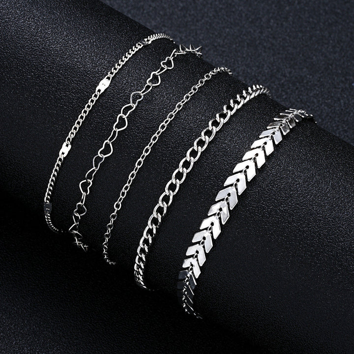 Close-up of a shimmering gold layered chain bracelet, featuring delicate adjustable links for women.