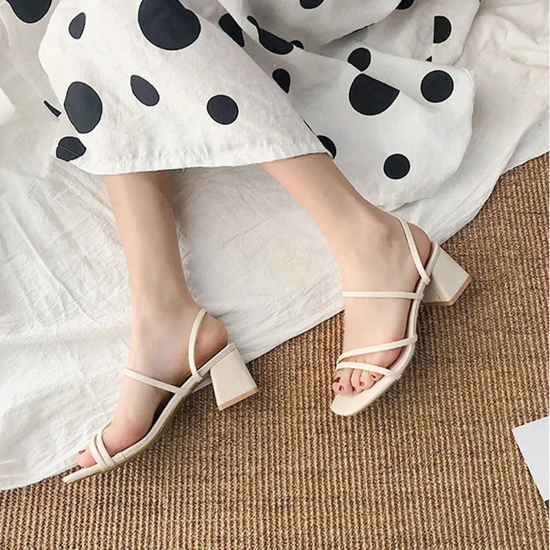 Trendy multi-strap block-heel sandals for women, featuring a stylish square toe for evening footwear.