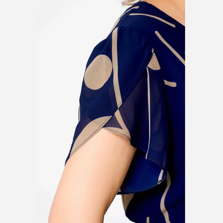 Chic women's navy polka dot midi dress with a flowy silhouette. Ideal for stylish spring and summer events.