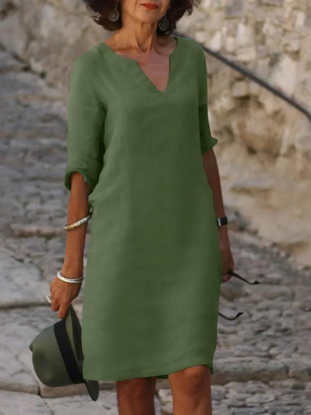 Sophisticated women's notch neck midi dress, offering a flattering fit for elegant daytime events.