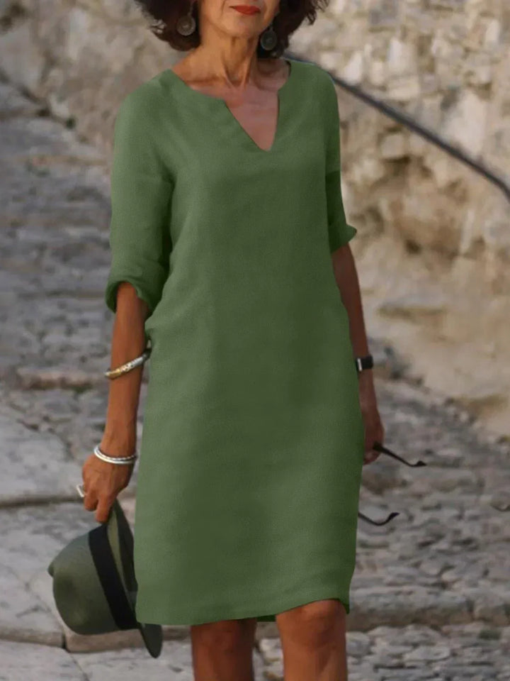 Sophisticated women's notch neck midi dress, offering a flattering fit for elegant daytime events.