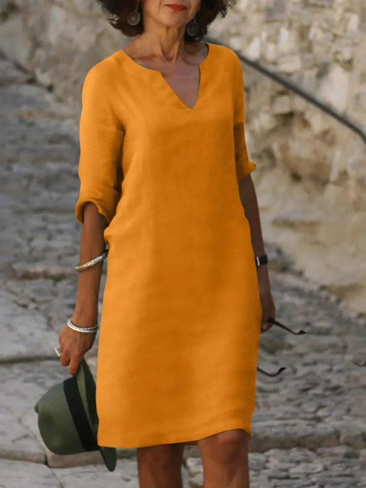 Women's flattering notch neck midi dress, a comfortable and chic staple for everyday elegance.