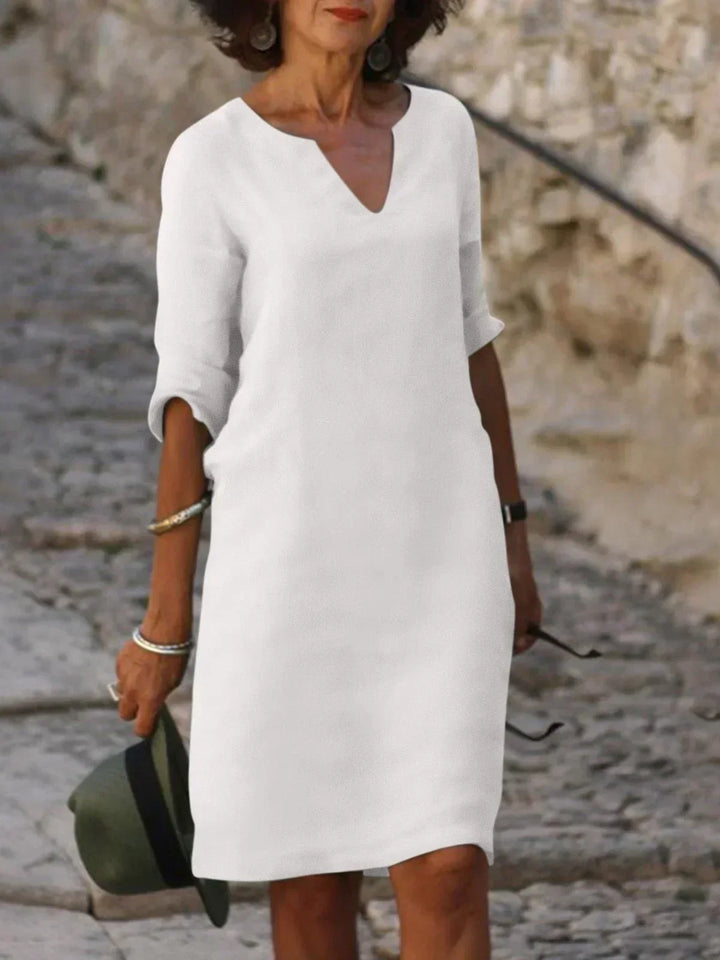 Elegant women's midi dress with a notch neck, designed for comfort and chic daytime style.