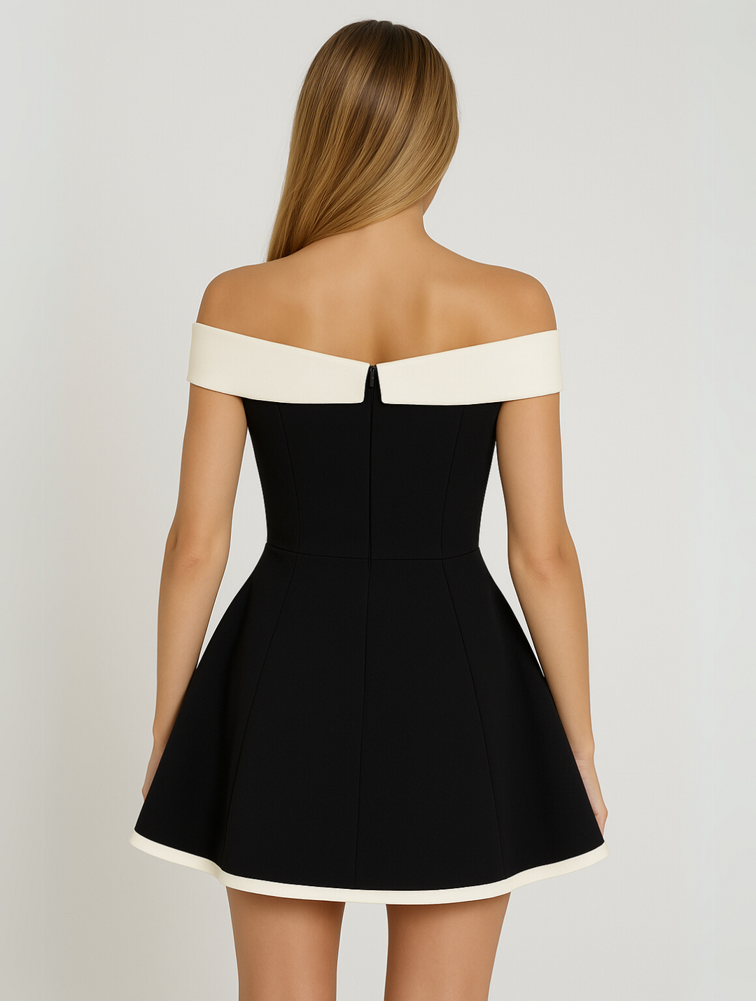 Women's elegant off-shoulder black contrast mini dress, perfect for a party, cocktail, or special occasion.
