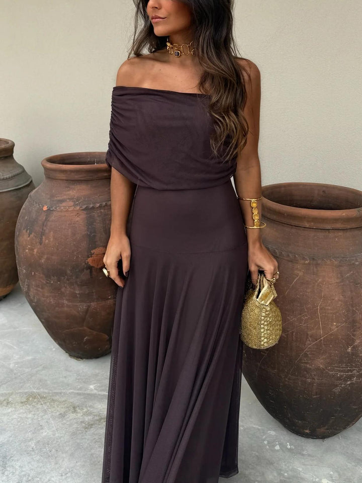Graceful women's off-shoulder maxi dress with a long silhouette, perfect for romantic evening or summer formal occasions.