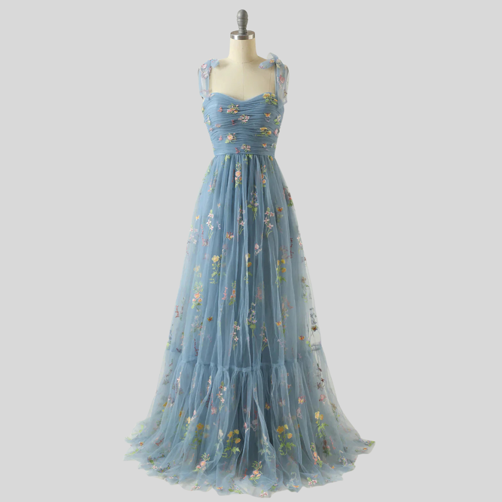 Formal women's party dress: elegant embroidered tulle ball gown with an off-shoulder design.