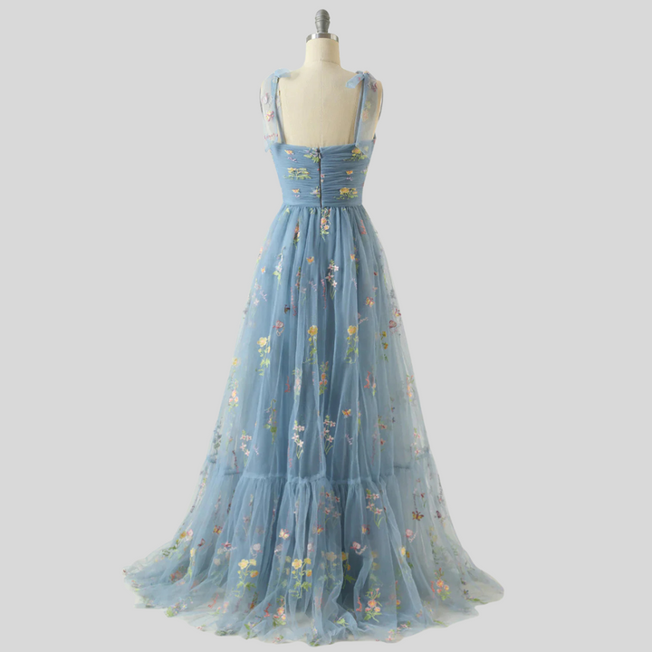 Chic women's off-shoulder embroidered tulle ball gown, ideal for elegant evening parties.