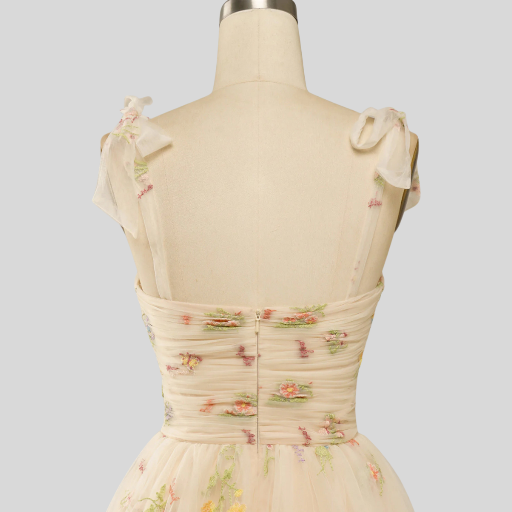 Beautiful women's embroidered tulle evening dress, an elegant off-shoulder ball gown design.