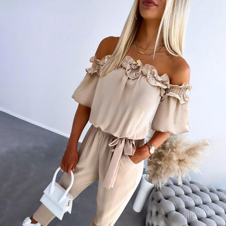 Elegant women's off-shoulder jumpsuit with tie-waist detail, perfect for chic evening wear or versatile summer fashion.