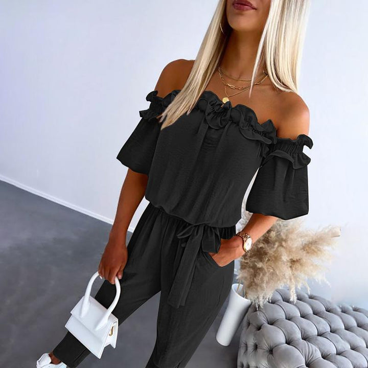 Comfortable flowy off-shoulder jumpsuit for women, featuring a stylish tie-waist, ideal for casual or elegant occasions.