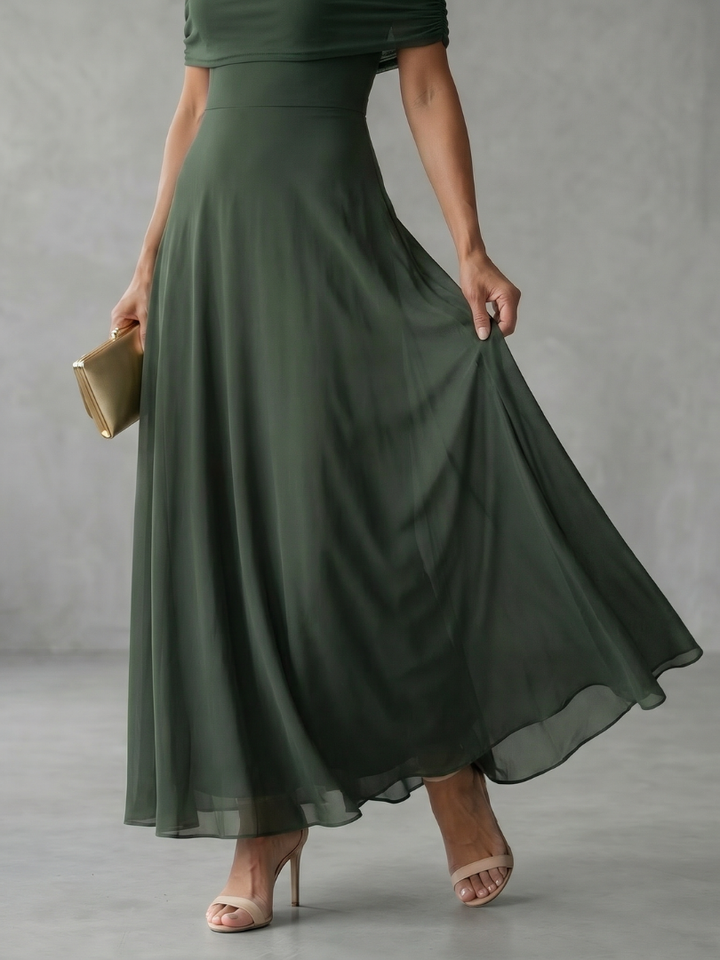 Feminine off-shoulder midi dress, elegantly draped, perfect for a chic evening or formal event.