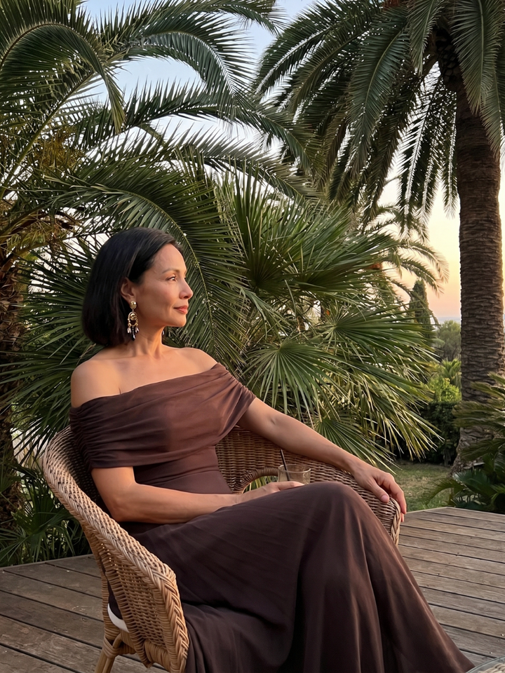 Stylish women's draped midi dress, off-shoulder design, embodying elegant evening fashion.