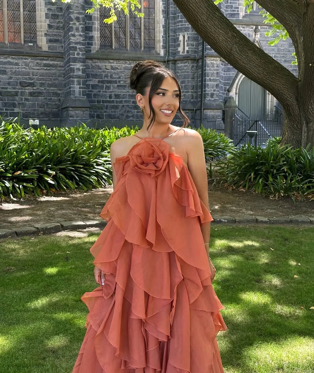 Long ruffled off-shoulder maxi dress with elegant design, suitable as a women's formal gown or party dress.