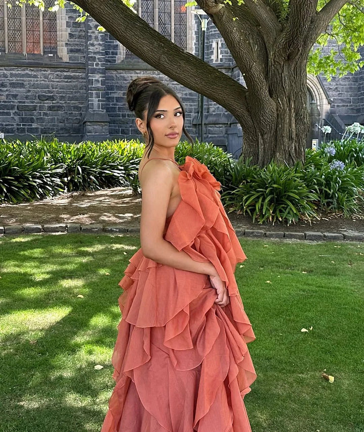 Elegant women's off-shoulder ruffled maxi dress, a sophisticated evening gown for formal events and celebrations.