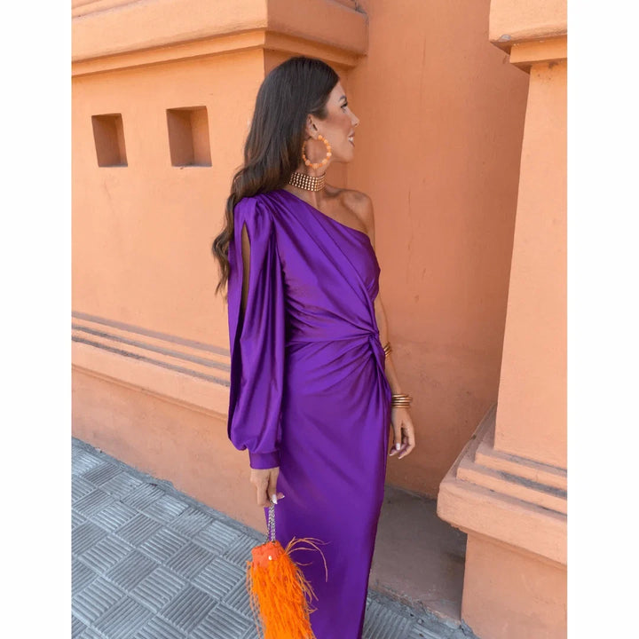 Classy women's evening gown: a one-shoulder maxi dress with a stunning twisted front and an elegant flowing slit skirt.