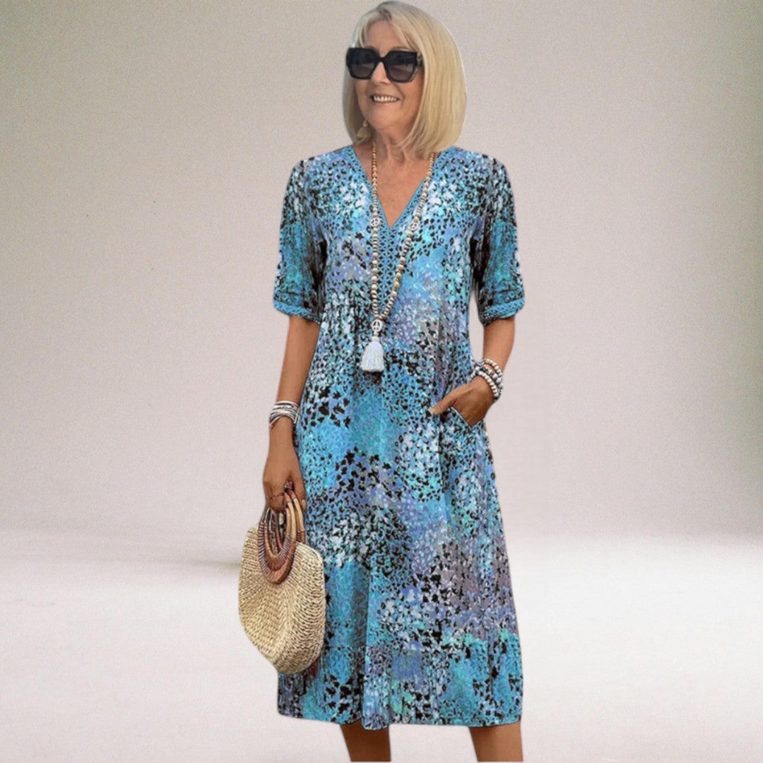 Stylish women's one-shoulder midi dress with vibrant floral print, ideal for casual chic spring & summer looks.