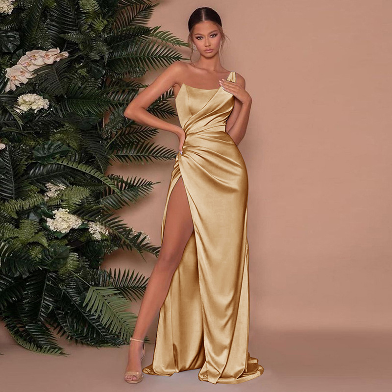 Beautiful gold one-shoulder formal dress for women, featuring a structured corset & attractive high slit, party ready.