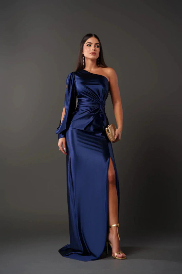 Detail shot: Elegant one-shoulder design of a women's formal maxi evening gown.