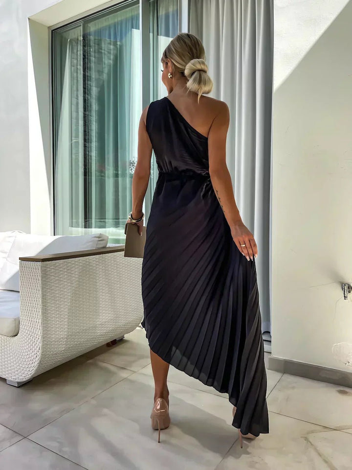 One shoulder pleated maxi dress for women with elegant floral detail, suitable for formal wear.