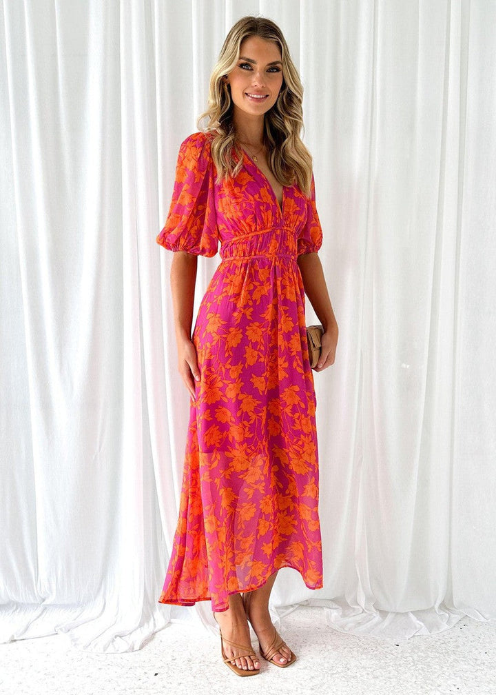Stylish orange floral V-neck maxi dress with long skirt, a chic party & occasion dress for women.