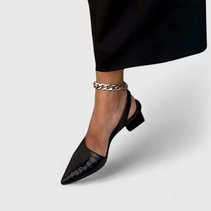 Elegant women's orthopaedic heels provide supportive comfort for workwear & formal events. Stylish black footwear.