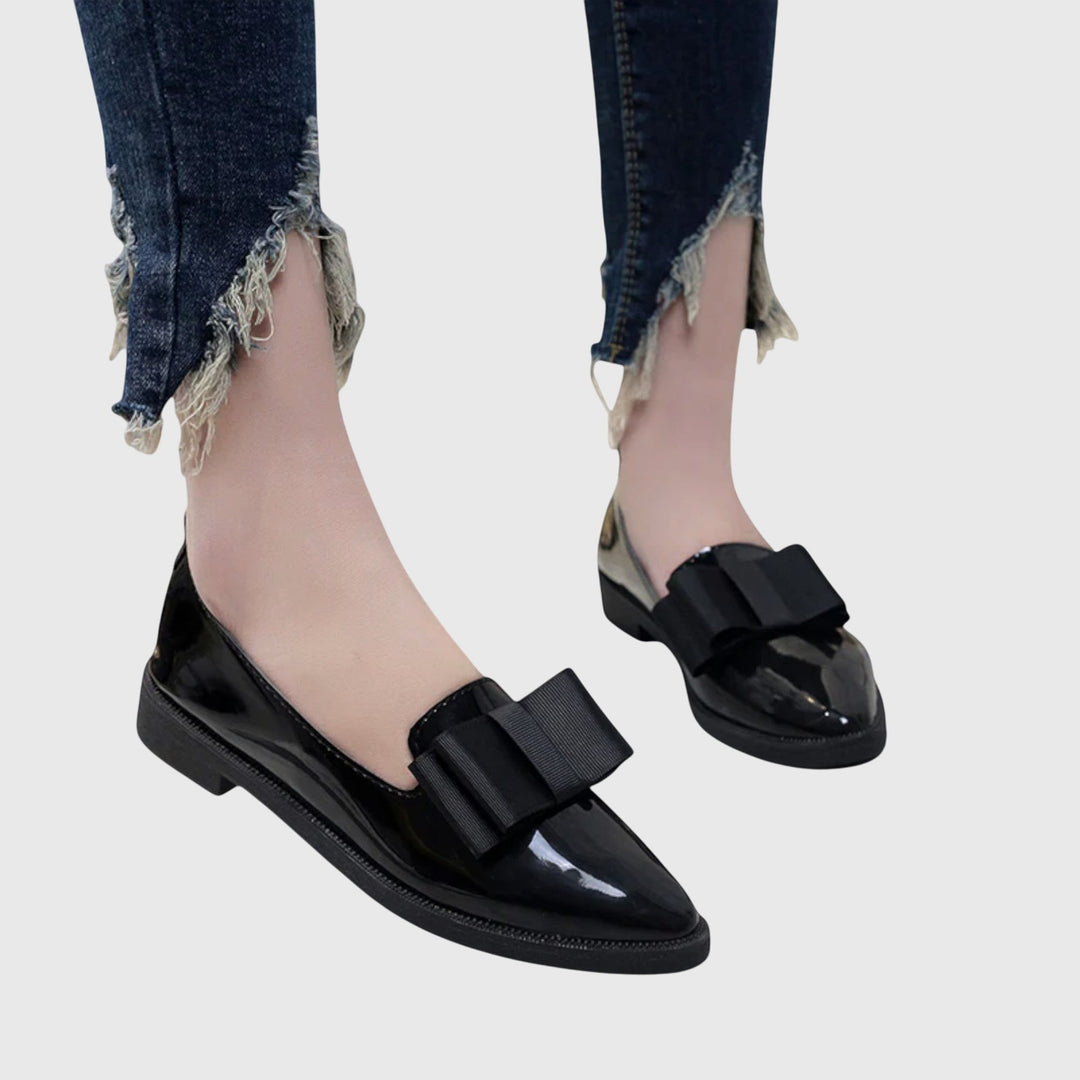 Fashionable red women's orthopaedic loafers, offering elegant comfort and classic slip-on style.