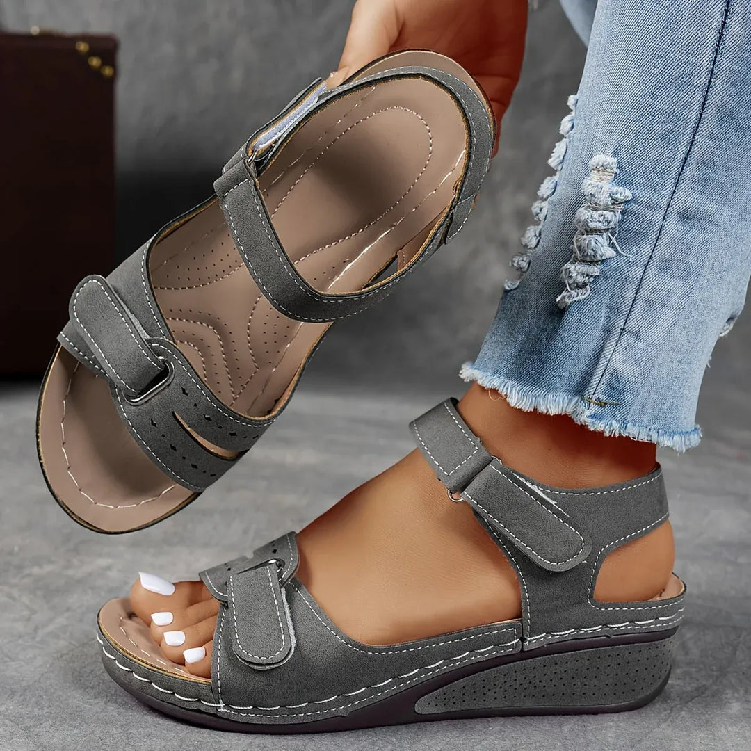 Chic women's comfort sandals, providing excellent arch support & elegant strap design for warm weather.