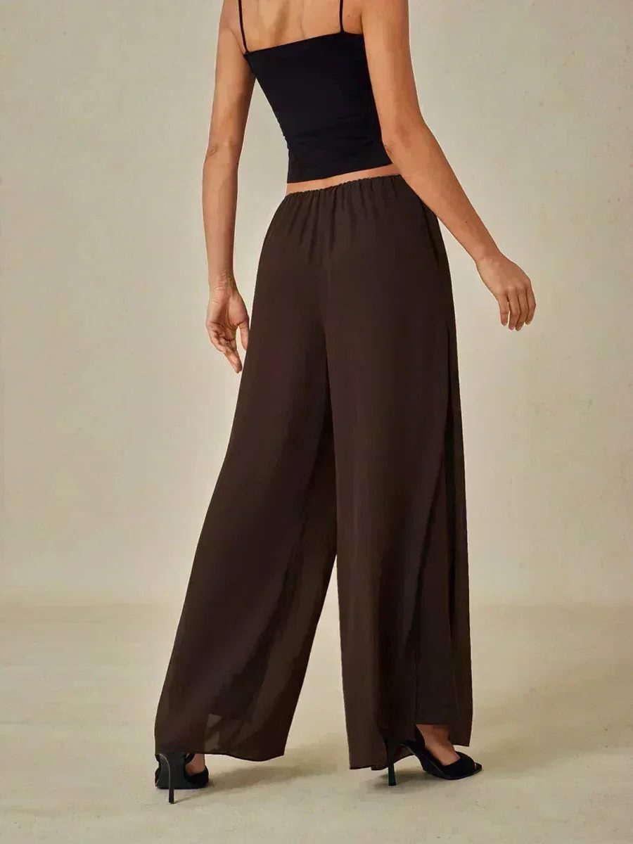 Flowy women's wide leg trousers, showcasing a unique overlay for an elegant and layered look.